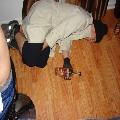 Me passed out on my friend's floor vent dressed as a bum with a Night Train in my hand.